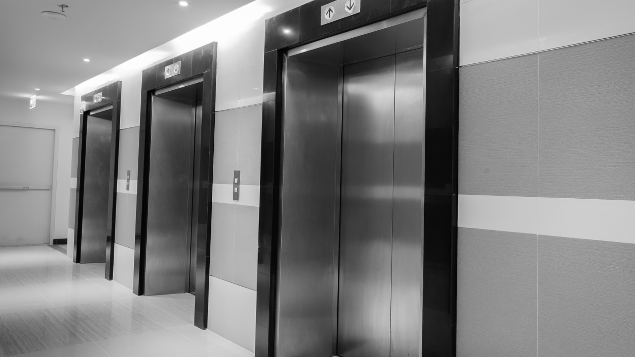 Modern elevator interior with sleek design and safety features