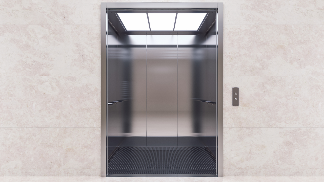 Professional elevator service team working on residential building lift